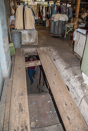 Entrance through stairway under plank door